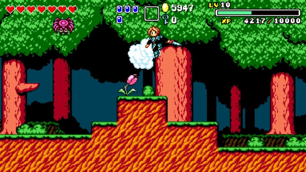 A character in an 8-bit style platform game jumping on a cloud over a grassy landscape with trees, a pink flower, and a spider enemy above.